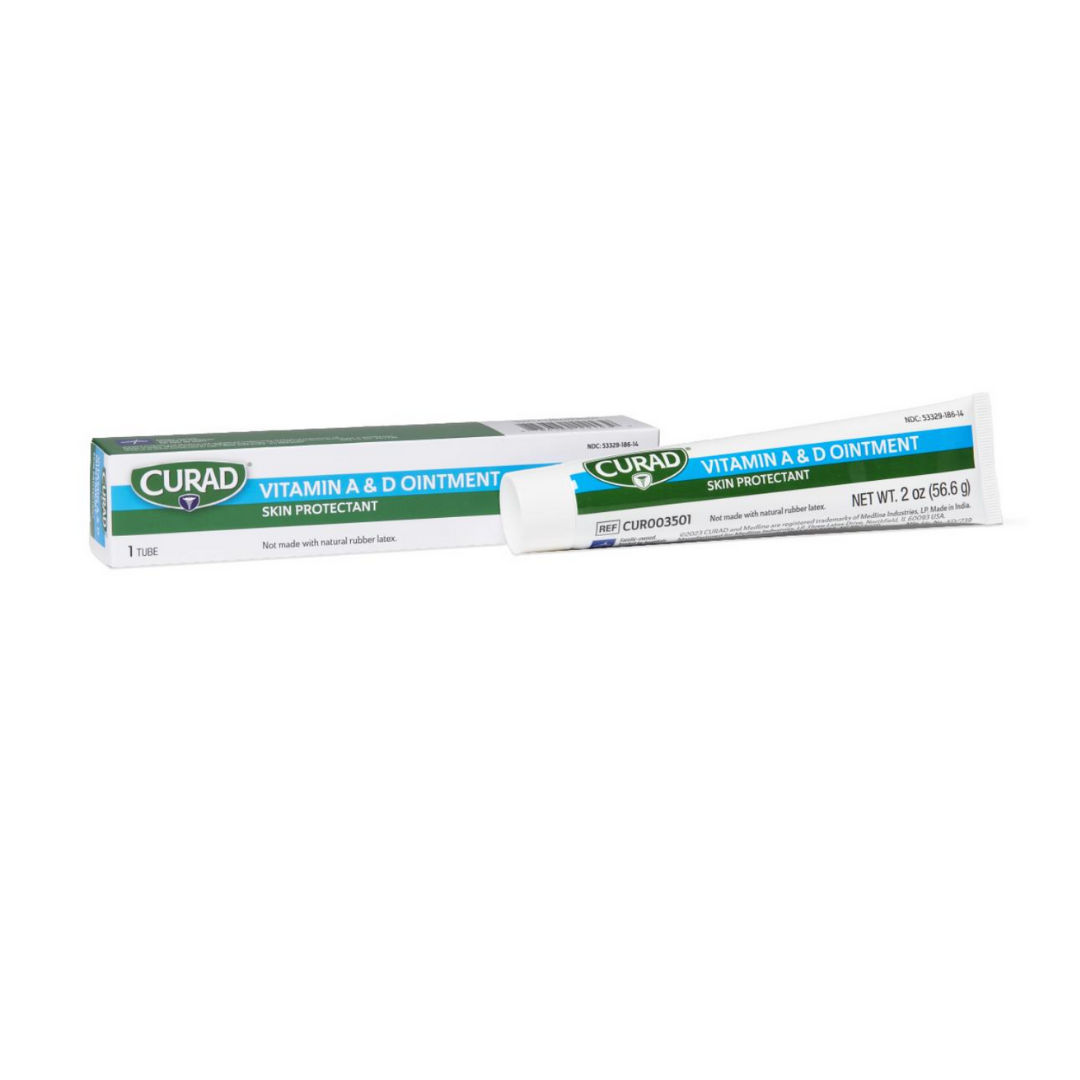 A 2-ounce (56.8g) tube of Medline Curad Vitamin A and D Ointment Skin Protectant and its box, both labeled to help moisturize skin, are displayed on a white background. The ointment contains white petrolatum for soothing care.
